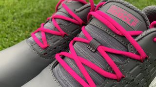 The bright pink laces on the charcoal pair really set off an outfit