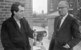 Stanley Kubrick and Arthur C. Clarke stand with a Celestron telescope on the patio of the Kubrick penthouse on Lexington Avenue, New York City, 1964.