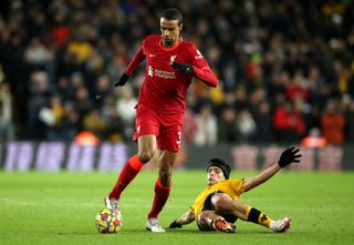 Liverpool’s Joel Matip (left) and Wolverhampton Wanderers’ Raul Jimenez battle for the ball during the Premier League match at Molineux Stadium, Wolverhampton. Picture date: Saturday December 4, 2021