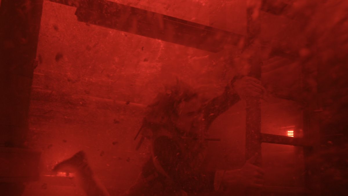 Haymitch under red-tinted water in The Hunger Games: Sunrise on the Reaping