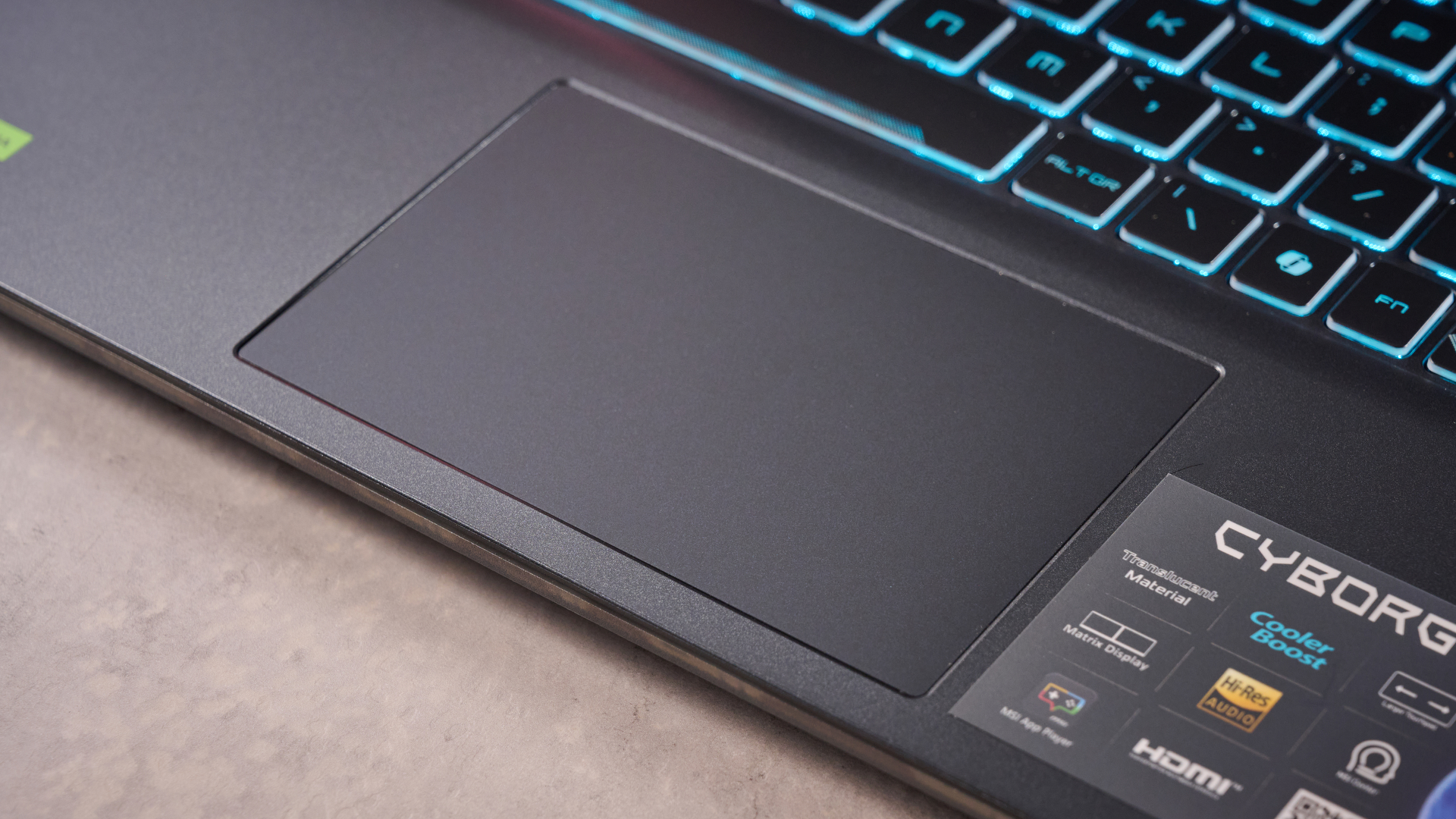 Close-up of touchpad on the MSI Cyborg 15 on a desk