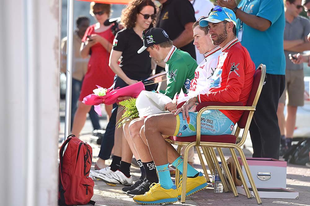 The riders await the podium ceremony