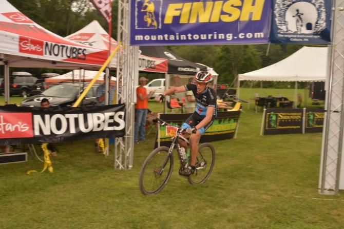 Masters winner Jukka Jokela crossing the finish line