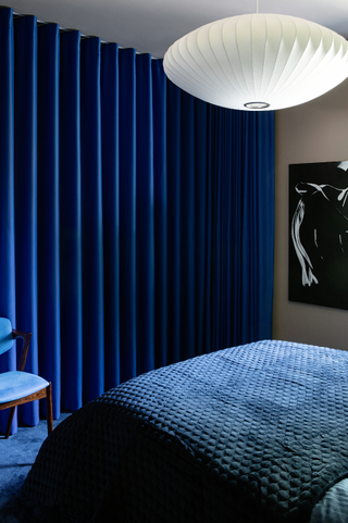 Blue bedroom with blue curtains