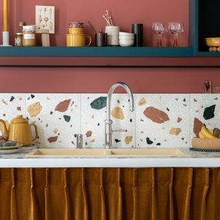 boiling water tap in kitchen with brown curtain