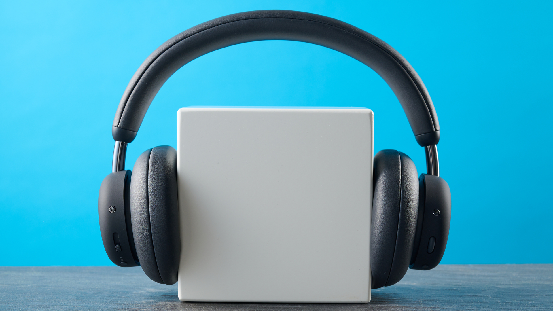 the cmf headphone pro / cmf by nothing headphone pro / nothing headphone pro in black photographed against a blue tom's guide background