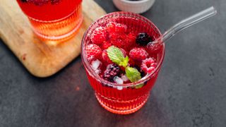 Fruit punch in glass with straw