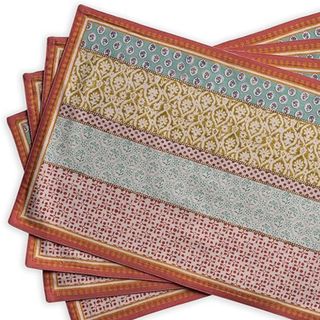 A stack of colorful, patterned placemats
