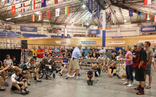 Andy McCord leads the pre-event rider's meeting.