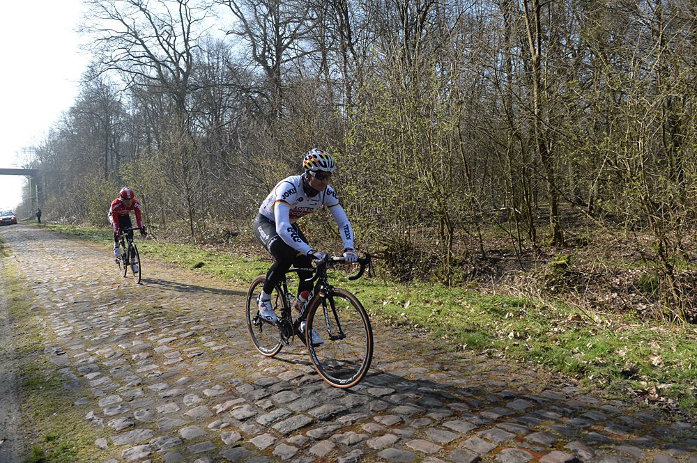 Andr&eacute; Greipel rides in the Arenberg Forest