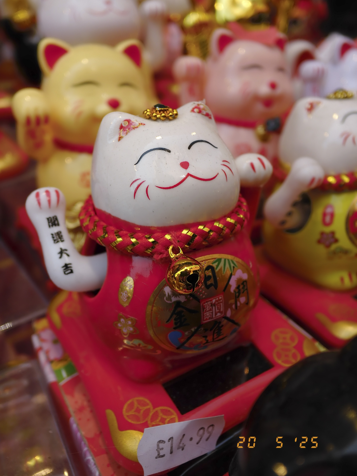 Closeup of maneki-neko in London's china town