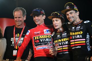 Richard Plugge with Sepp Kuss, Jonas Vingegaard and Primoz Roglic after they swept the Vuelta podium.