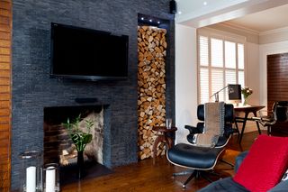 An open storage unit by the fireplace