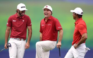 Jupiter Links GC - made up of Max Homa (left), Kevin Kisner (centre) and Tiger Woods (right) - share a laugh during a TGL match