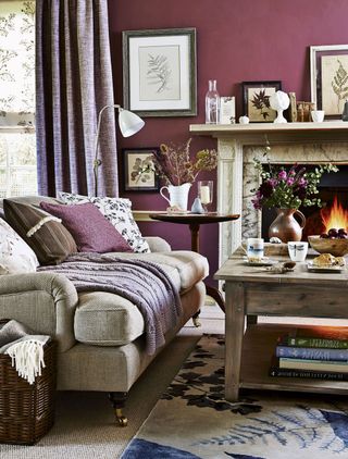 pink living room with sofa and carpet flooring