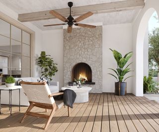 covered deck with fireplace and plants