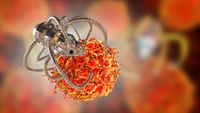 Illustration of a spider-looking metal robot grasping a cancerous cell. 