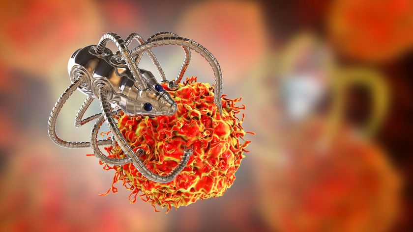 Illustration of a spider-looking metal robot grasping a cancerous cell. 