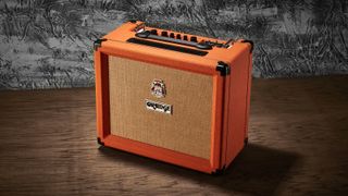 Orange Rocker amplifier on a wooden floor