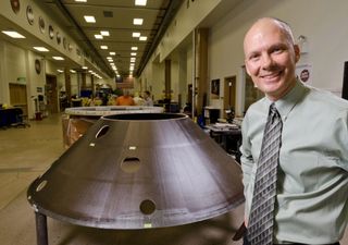 Stu Spath, InSight program manager at Lockheed Martin Space Systems Company, near the back shell for the Mars-bound Interior exploration using Seismic Investigations, Geodesy and Heat Transport (InSight) spacecraft.