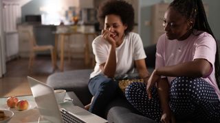 Are 4K laptops worth it? image shows two women watching content on a laptop