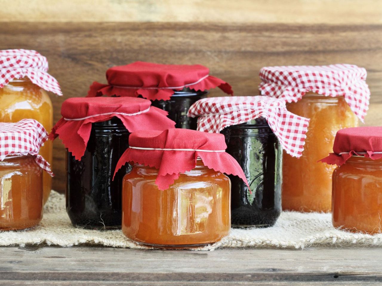 Different Sized And Colored Jars Of Jelly And Jams