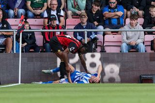 Maxim de Cuyper collides with the advertisement hoardings against Bournemouth