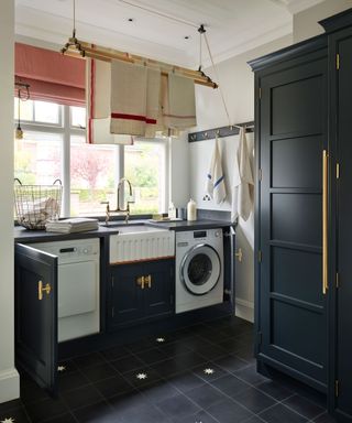 Laundry room organization with storage and painted cabinets