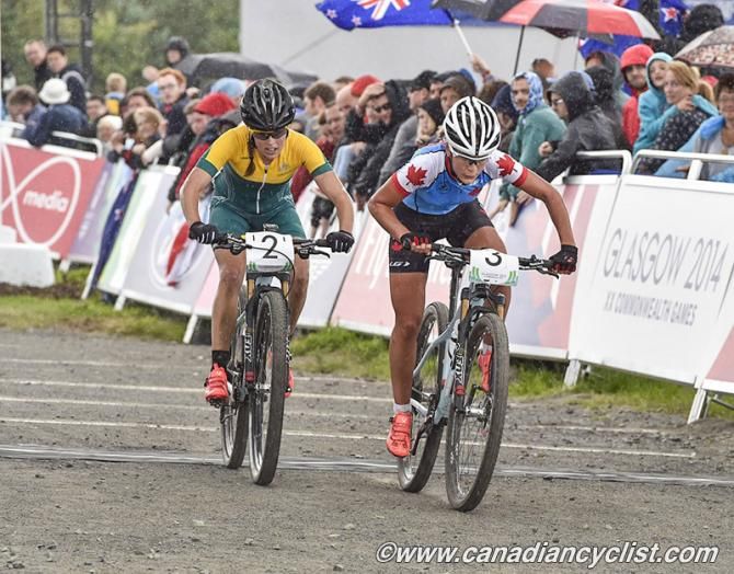 Emily Batty and Rebecca Henderson starting the last lap in the rain