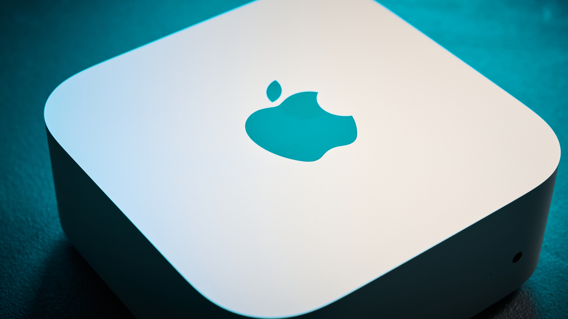 The Apple logo on top of the Apple Mac Mini M4