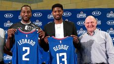 Kawhi Leonard Paul George and owner Steve Ballmer of the Los Angeles Clippers attend the introductory press conference in 2019.
