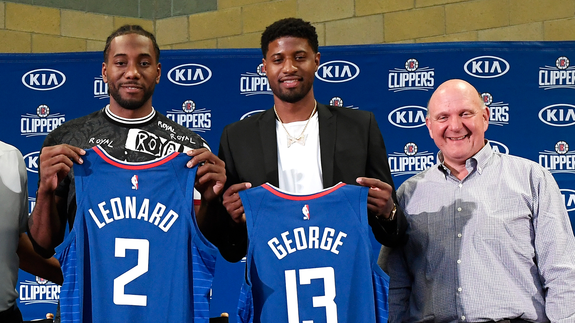 Kawhi Leonard Paul George and owner Steve Ballmer of the Los Angeles Clippers attend the introductory press conference in 2019.