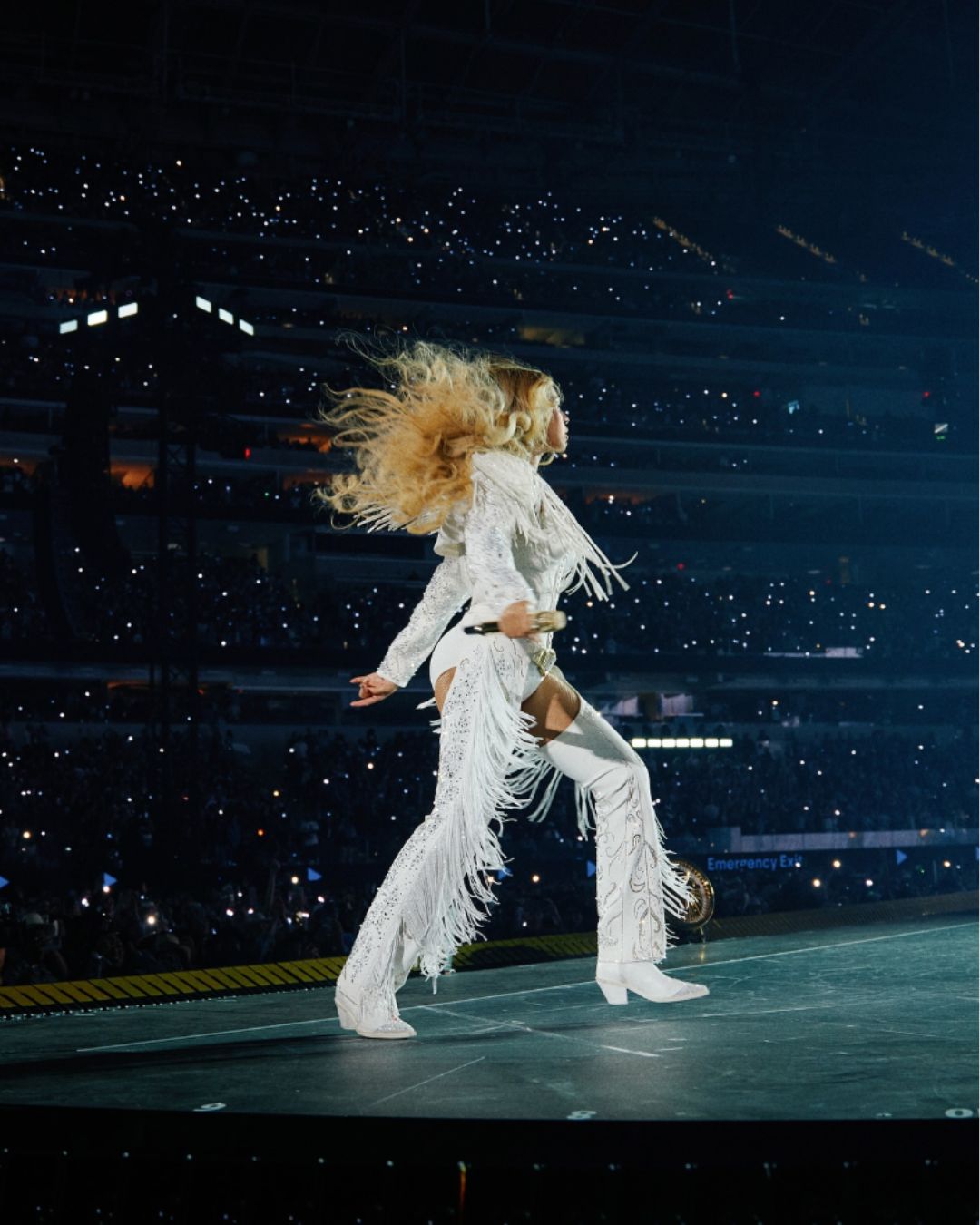 Image of Beyoncé performing at the Cowboy Carter tour.