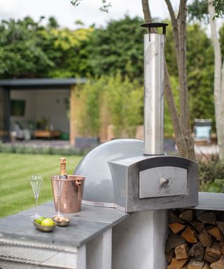 a pizza oven built into an outdoor kitchen