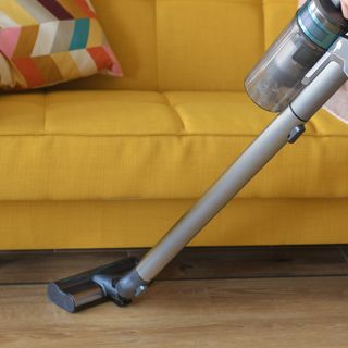 Cordless vacuum cleaner vacuuming floor