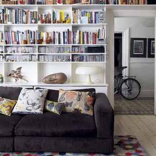 living room with sofa and book shelf