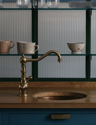 circular sink in wooden countertop