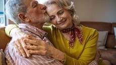 picture of elderly married couple embracing