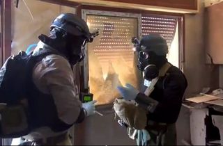 UN weapons inspectors collecting samples during their investigations at Zamalka, east of Damscus, Syria, in August.