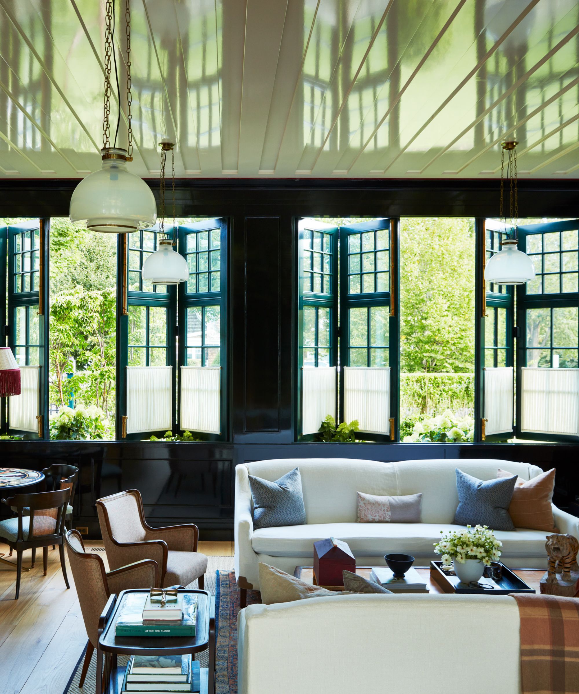 Bright sitting room with windows open to the garden