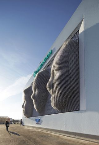 The MegaFaces pavilion from the front. The kinetic façade recreates people's faces.