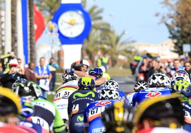 The peloton heads out of town