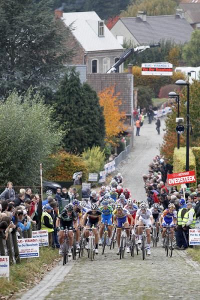 The elite men charge up the Koppenberg on the opening lap.