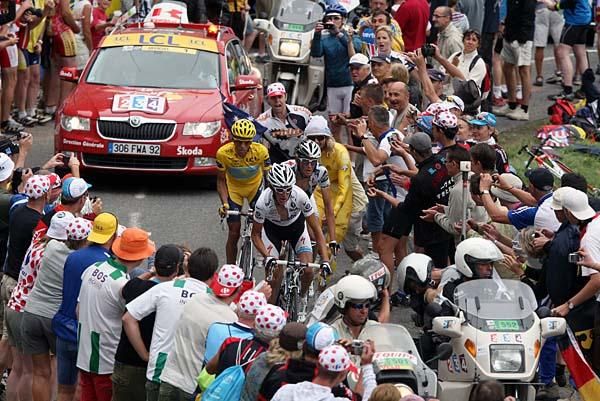 Fr&auml;nk and Andy Schleck (Saxo Bank) and Alberto Contador (Astana) race uphill.