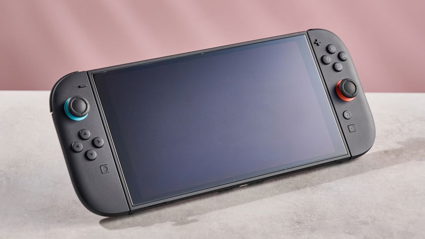 The Nintendo Switch 2 with the Belkin Temperd Glass Anti-Reflective Screen protector applied in front of a pink background.