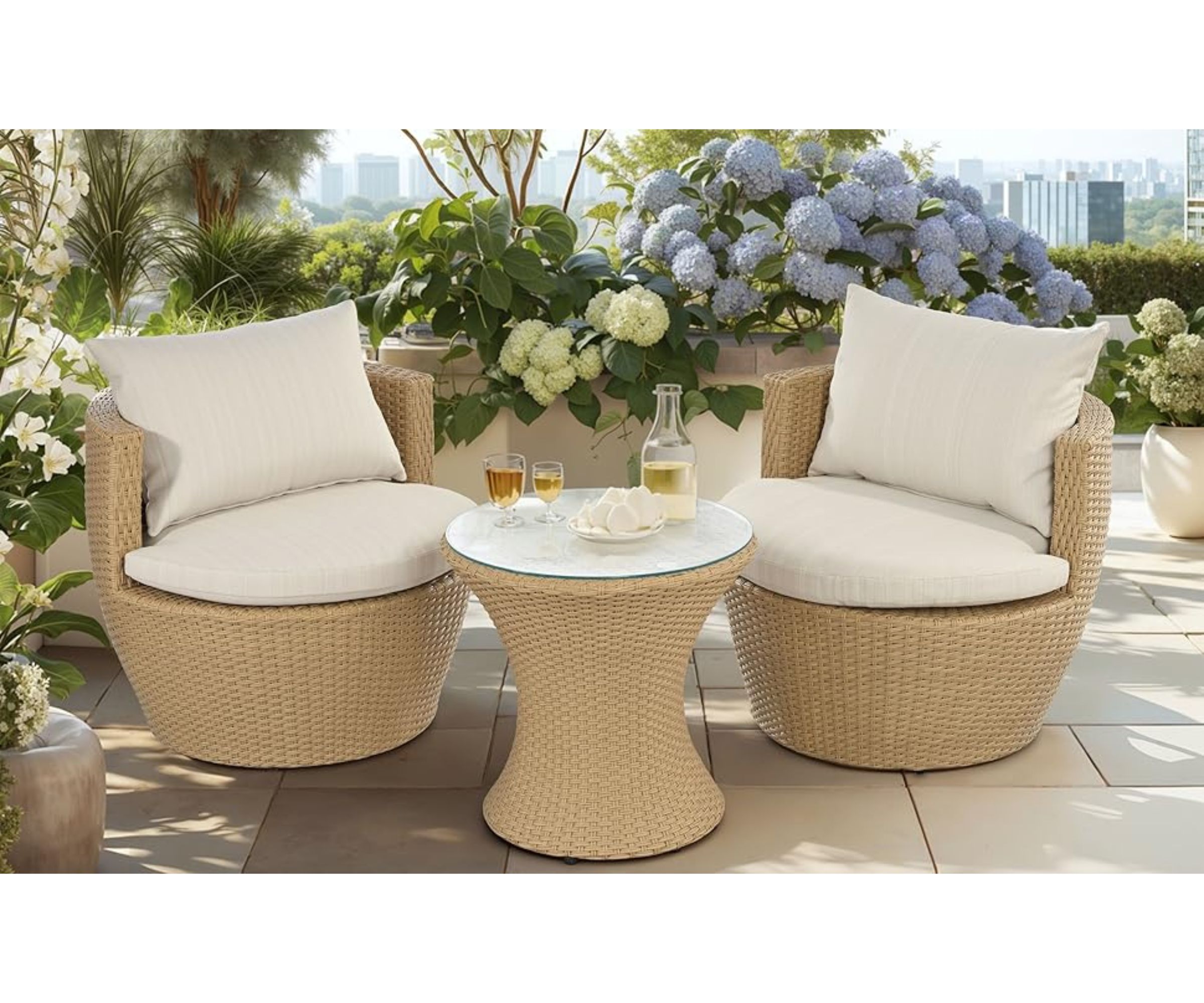 three piece wicker garden patio set with two tub chairs and a round glass topped table surrounded by hydrangeas