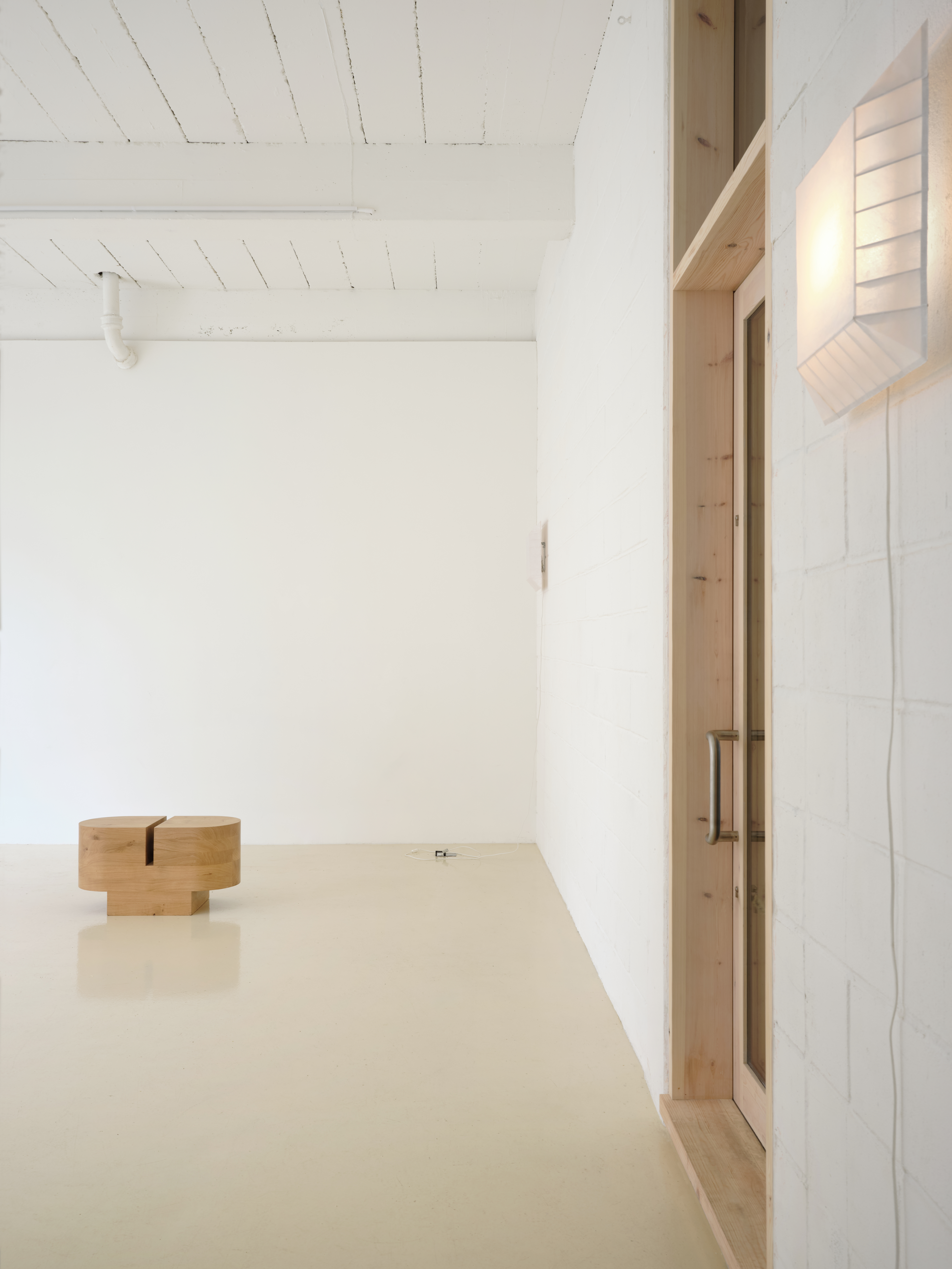 All Projects, a new minimalist new gallery by EBBA, in an old east london warehouse - brick outside and clean, textured surfaces inside