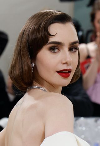 eyebrow shapes - Lily Collins attends the 2023 Costume Institute Benefit celebrating "Karl Lagerfeld: A Line of Beauty" at Metropolitan Museum of Art on May 01, 2023 in New York City