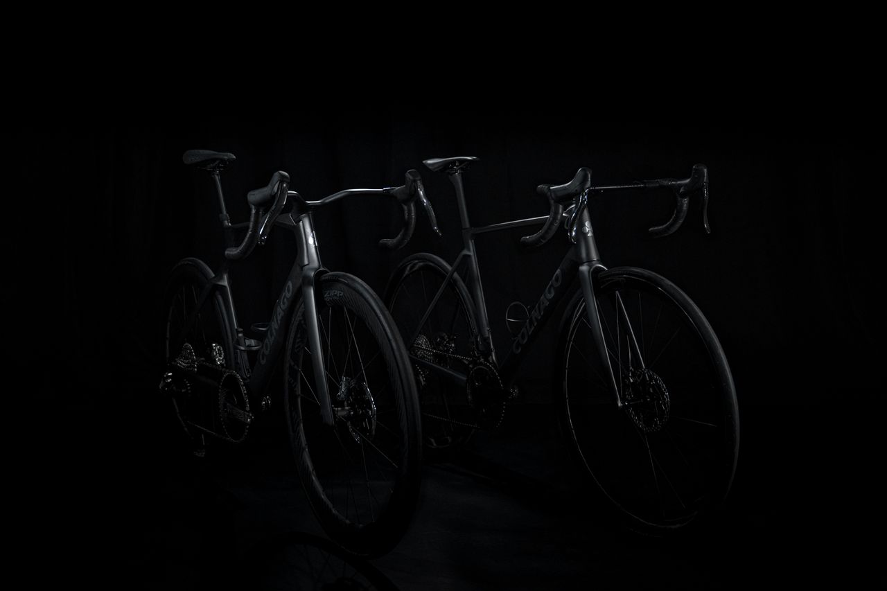 shadowy shots of a black Colnago bike on a black background