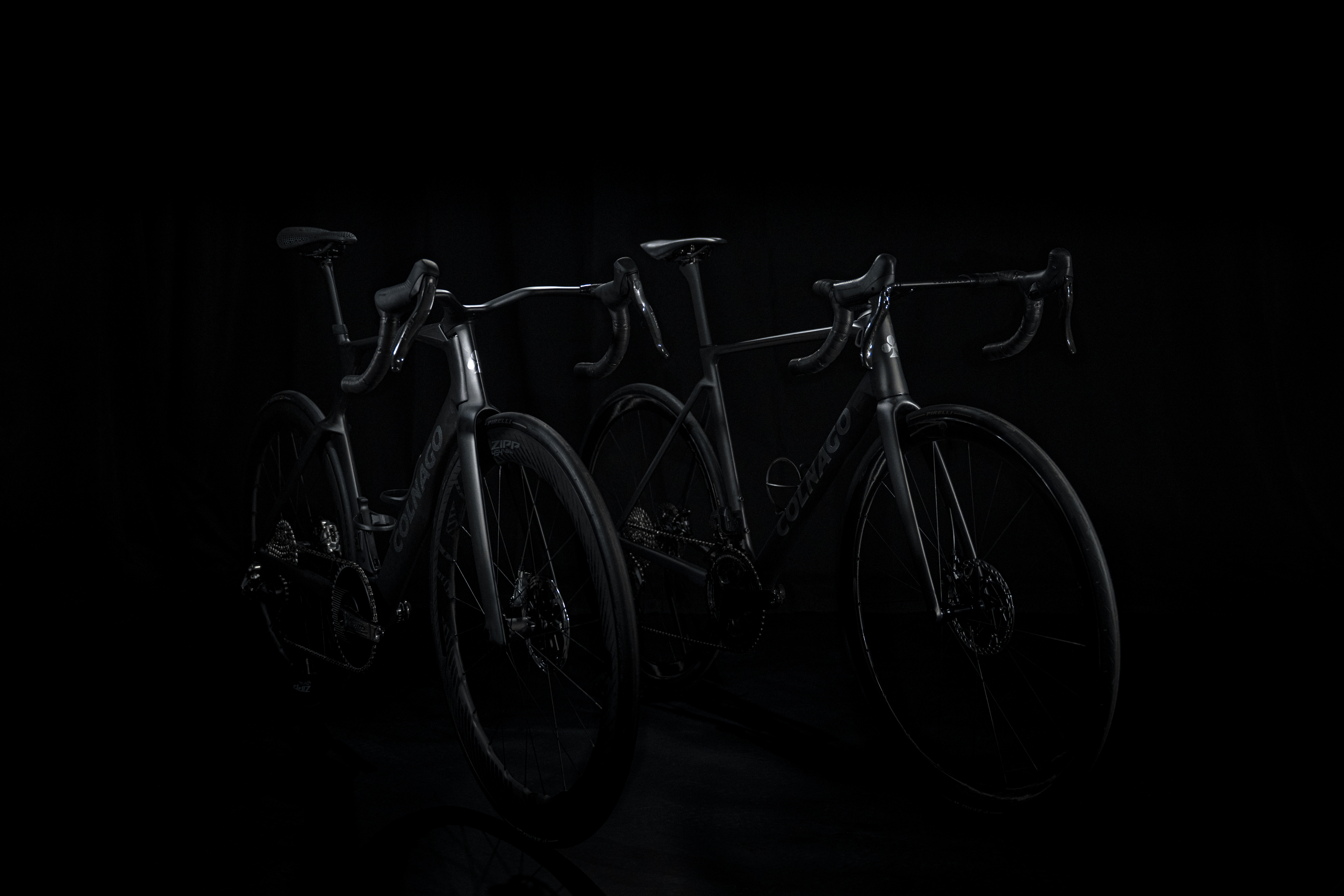 shadowy shots of a black Colnago bike on a black background